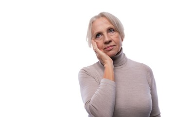 Mature woman with gray hair is worried and sad