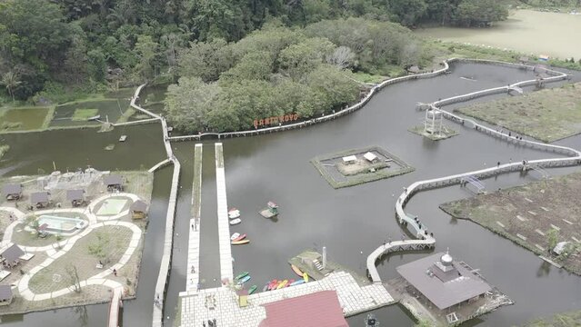 Establish aerial view of the water tourism in Banto Royo, Agam Regency, West Sumatra. d-log raw stock video