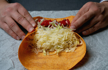 Rolling a burrito on a paper