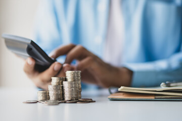 Financial planning and investment. Businessman using calculator calculating income and expenditure...