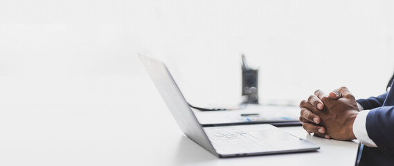 Businessman hands working with laptop.