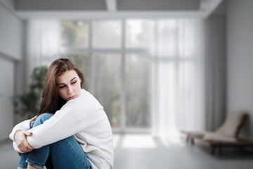 Fototapeta premium Depressed young woman with problem at home