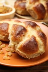 Tasty hot cross buns on table, closeup
