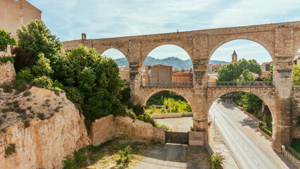 Fototapeta premium Ancient Aqueduct of Teruel, Spain with Verdant Surroundings