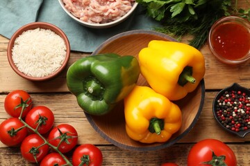 Making stuffed peppers. Vegetables and ground meat on wooden table, flat lay