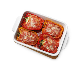 Tasty stuffed peppers in dish isolated on white, top view