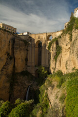 View of the iconic 18th-century stone bridge of Ronda, Spain.