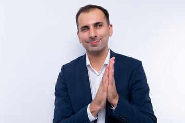 A handsome business man in a stylish blue jacket is preparing for a business meeting