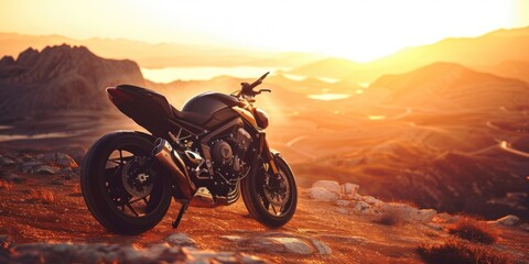 Fototapeta premium A motorcycle parked on top of a rocky hill with a scenic landscape in the background