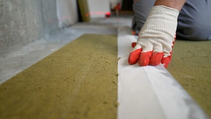 Stone wool for the floor. Soundproofing of floors. Floor repair, sound insulation, glass wool. The...