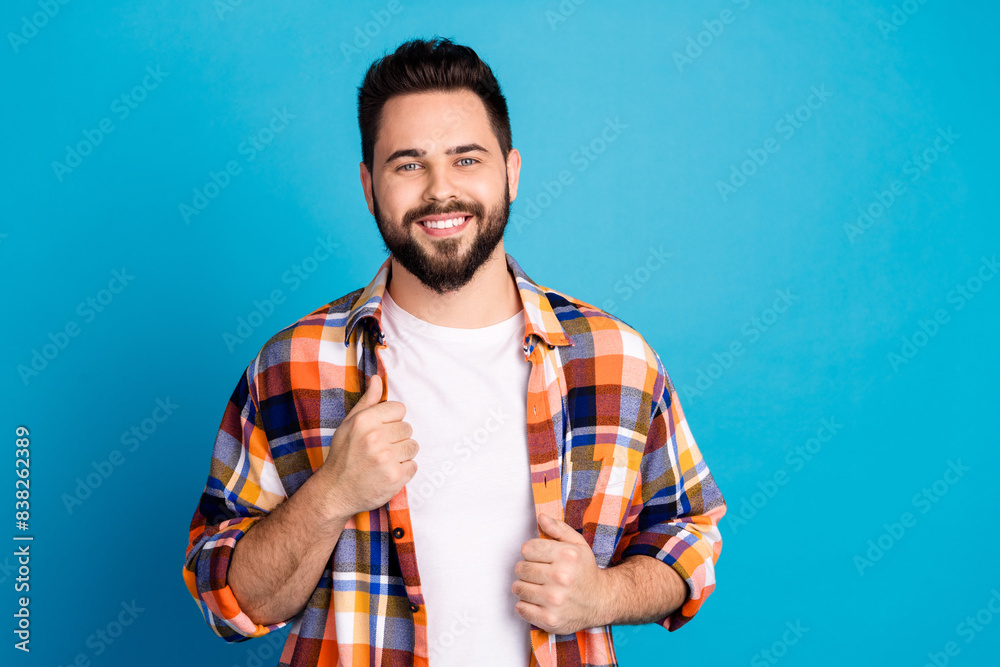 Poster Portrait of nice young man empty space ad wear shirt isolated on blue color background