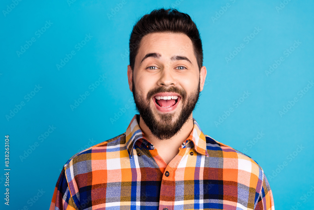 Canvas Prints Portrait of nice young man open mouth wear shirt isolated on blue color background