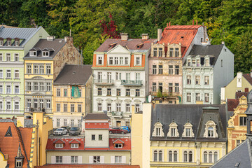 Colorful Historic Facades in Karlsbad (Karlovy Vary) Against a Forested Backdrop