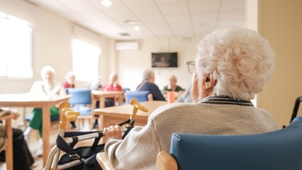 Elderly woman with foldable walker in nursing home