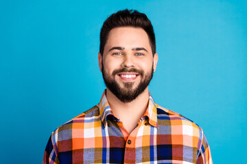 Portrait of nice young man beaming smile wear shirt isolated on blue color background