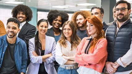 Fototapeta premium Contented multiethnic business team posing in office