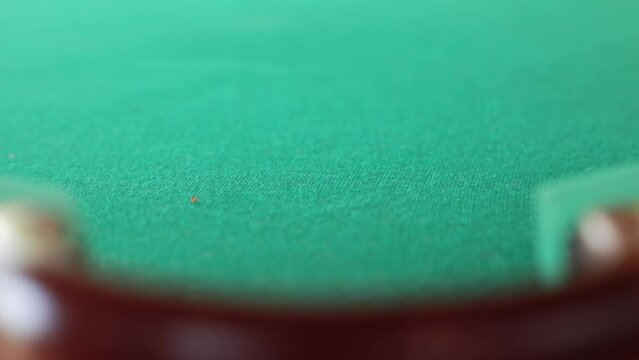An exciting moment when the billiard balls roll into the pocket after a precise shot