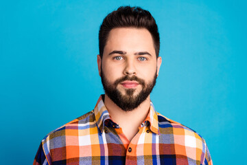 Photo of nice young man calm face wear shirt isolated on blue color background