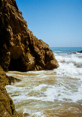 The rocky shore line, pelicans, and waves, at Leo Carrillo State Park in the Malibu coast. Pictures taken in the summer on 35mm film