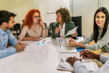 Group of businesspeople having a briefing in a boardroom. Businesspeople working together in a modern workplace.