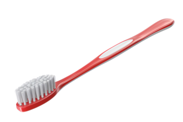 A red toothbrush with white bristles isolated on a white background, perfect for oral hygiene and dental care-themed projects.