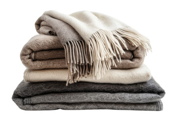 A stack of cozy, soft blankets in beige, white and gray with fringes. Perfect for a relaxing evening at home in isolated on transparent and white background
