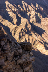 Rock layers of the Nama group, on the folded and tilted Namaqua metamorphic complex, in the steep walls of the Fish River Canyon of Southern Namibia