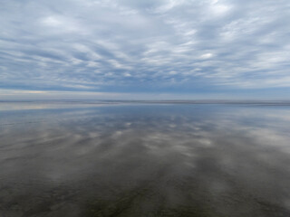 Obraz premium Aerial View: Wadden Sea near Wierum, Friesland, Netherlands and Stunning Cloud Reflections