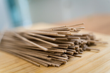 Cutting board with raw japanese buckwheat pasta
