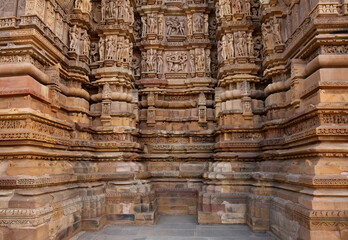 Erotic sculptures and intricate designs on the wall of Kandariya Mahadeva Temple in the Khajuraho...