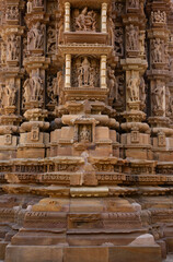 Sculptures and intricate designs carved on the wall of Chitragupta Temple in the Khajuraho temple complex, India