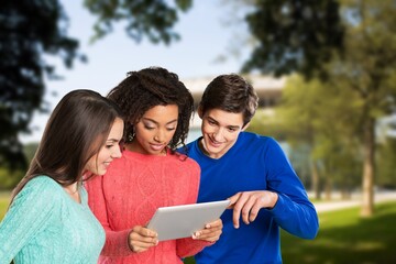 Group of cheerful college students in a campus park