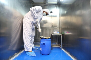 dispensing process of medicine drug powder in a pharmaceutical factory. weighing Active pharma...