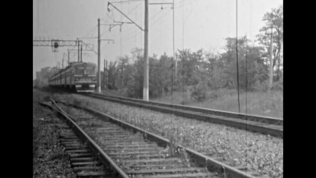 Close up, train carriages passing, black white film. Goods, passenger transport transportation by rail. Railway in motion. Cargo logistic in 1980s. railroad Vintage black white film. Retro archive. 4k