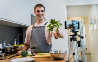 The chef is broadcasting live from workshop how to prepare a vegetarian green curry