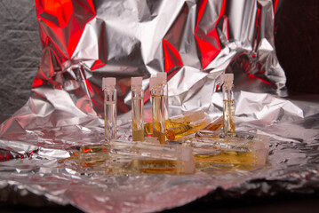 close up of old perfume samples on background