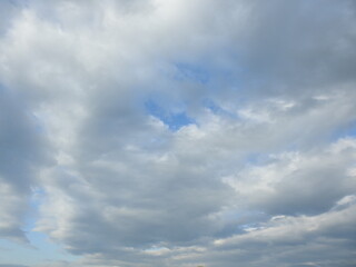 Obraz premium Cumulus clouds within a blue sky over Northampton County, Pennsylvania. Cloudscape.