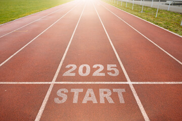 Start of new year. Changes of year 2025, 2026, 2027 on Running track. Concept of new ideas starting in new year, planning along with setting objectives to set KPI goals for success in life.