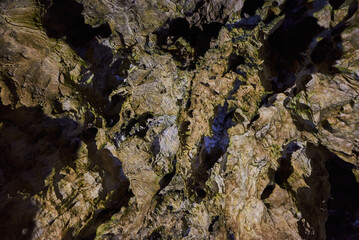 Rock formations and abstract texture on the walls in the Polovragi Cave with stalactites and stalagmites
