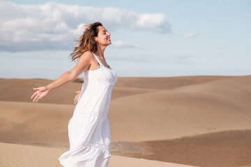 Obraz premium Middle-aged woman taking a breath in a heavenly place and breathing. Concept: Rest, relaxation