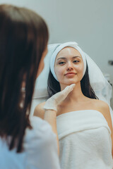 girl at a cosmetologist's office doing skin cleansing