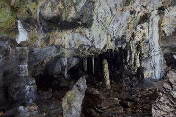Rock formations and abstract texture on the walls in Muierilor Cave with stalactites and stalagmites