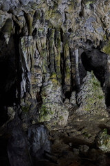 Rock formations and abstract texture on the walls in Muierilor Cave with stalactites and stalagmites