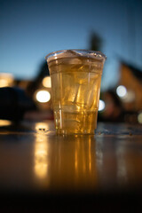Beer, served in glasses, is a popular alcoholic drink around the world and is often used as a celebratory drink during festivals. Beer was served with ice in beer glasses because of the hot weather.