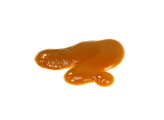 Baby fruit puree spilled on white background. Baby fruit puddle isolated.