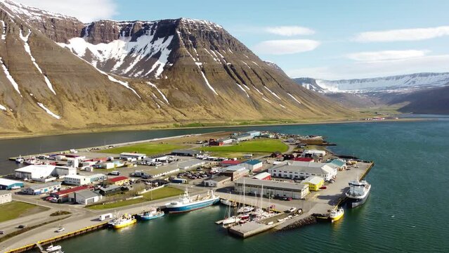 Aerial view of Isafjordur (&Iacute;safj&ouml;r&eth;ur) and the harbour, Iceland, colorful buildings, sea, fjord, moutains with snow. Arctic climate, bright light. Polar climate. Westfjords region. 