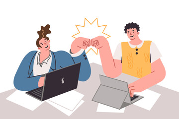 Successful collaboration of men students working sitting at desk, punching after end of business day