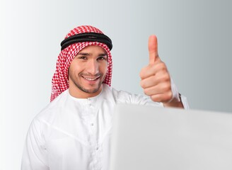 A saudi arab character using laptop