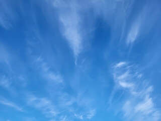 Beautiful blue sky and feathery white clouds nice bright day