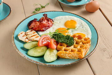 Savory Breakfast Platter with Belgian Waffle, Eggs, Bacon, Vegetables, and Cheese